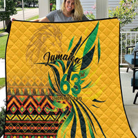Yellow quilt with diamond stitching and green graphic "Jamaica 63 Independence Day"