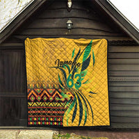 Yellow quilt hanging on dark wall with green "Jamaica 63" and Independence Day text