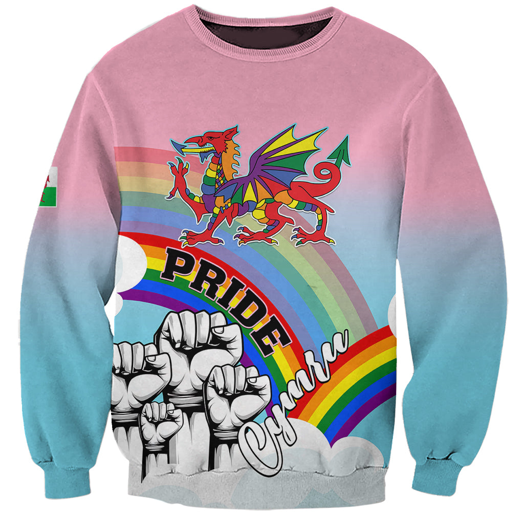 Unisex pink-to-blue sweatshirt with rainbow dragon, fists, and Pride print