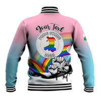 Back of pink-to-blue gradient baseball jacket with Pride Cymru logo and striped cuffs