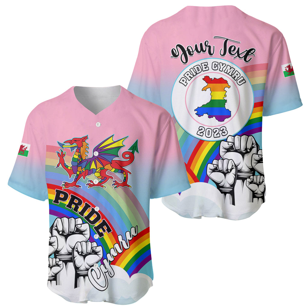 Pink baseball jersey showing Welsh dragon front and Pride Cymru 2023 back graphic