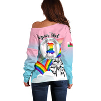 Women’s off-shoulder sweater, back view: Pride Cymru 2023 rainbow emblem and gloves