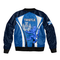 Blue bomber jacket with ribbed hem and THISTLE back graphic featuring lion crest