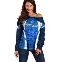 Blue off-shoulder rugby sweater with white stripes and Scotland crest lion graphic