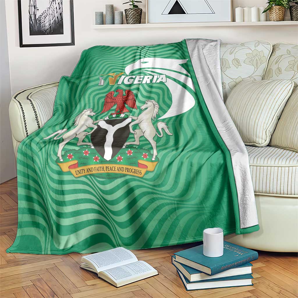 Green Nigeria-themed blanket with wavy stripes and national crest in center