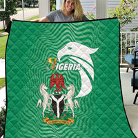 Green Nigeria flag quilt with quilted diamond pattern and central coat-of-arms graphic