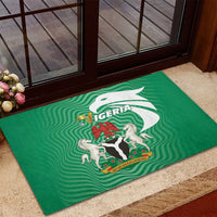 Green rubber doormat with Nigeria coat of arms and eagle emblem graphic