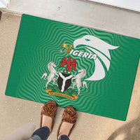 Green rubber doormat with Nigeria crest, lions, and eagle design