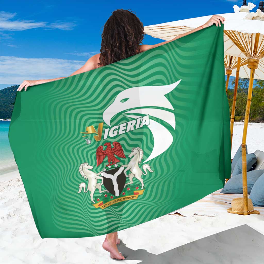 Green Nigeria flag sarong fully spread, showing central crest and lettering.