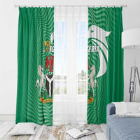 Green window curtain panels with Nigeria crest and wavy stripe pattern