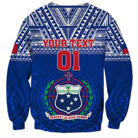 Blue crewneck rugby sweatshirt with Polynesian tribal pattern, YOUR TEXT 01 crest graphic