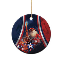 Blue round ceramic Christmas ornament with Santa and “Joyeux Noel” lettering