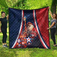 Folded navy and red quilt with white stripes, Santa face and 'Joyeux Noel' text