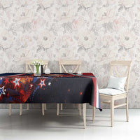 Christmas tablecloth on dining table, navy and red star pattern with Eiffel Tower artwork