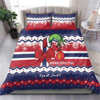 Christmas bedding set on bed: red and blue Norway pattern with character, bow and pillows