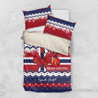 Christmas bedding set flat lay: duvet and two pillowcases, red blue Norway snowflake design