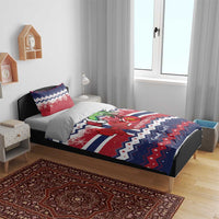 Christmas bedding set on bed with red, white, blue Norway pattern, character and bow
