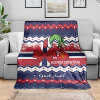 Nordic Christmas blanket draped on sofa, reindeer and zigzag pattern