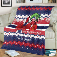 Christmas throw blanket with reindeer, stars, and red striped pattern