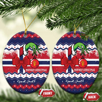 Two round ceramic ornaments with red bow, green figure, "God Jul" and gold hanging loops