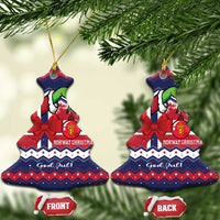 Bell-shaped ceramic ornament pair on tree: dark blue/red stripes, red bow, green figure