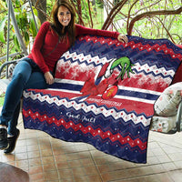 Norway Christmas quilt on patio sofa, blue red white zigzags with green reindeer graphic