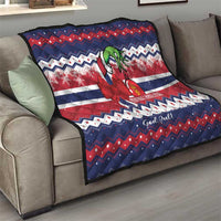 Norway Christmas quilt draped over couch, blue red white chevron stripes with reindeer