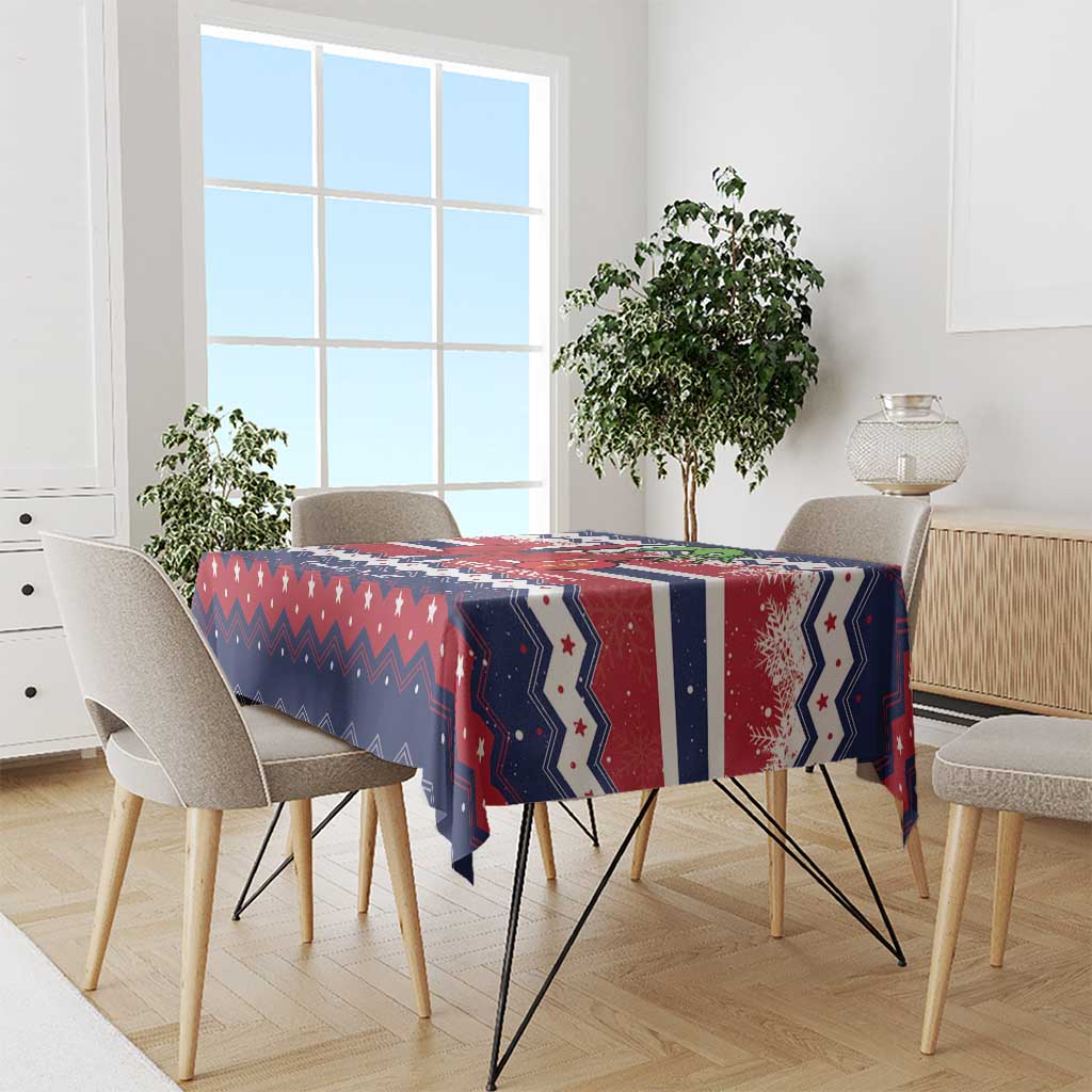 Christmas tablecloth on rectangular dining table in navy, red and white with zigzag and star motifs
