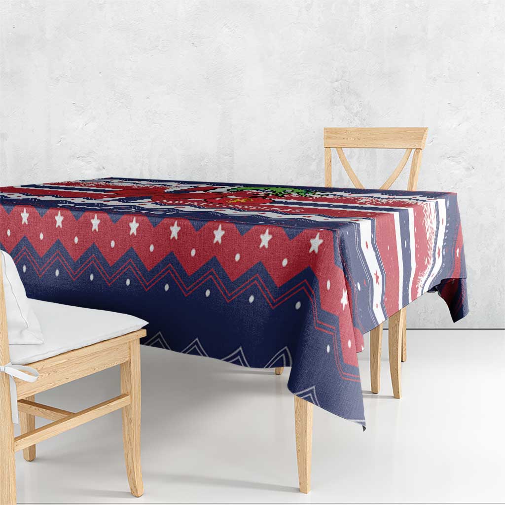 Navy and red Christmas tablecloth with star accents, zigzag borders and festive motif print