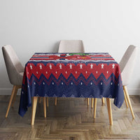 Rectangular Christmas tablecloth on dining table in navy and red with star and chevron pattern