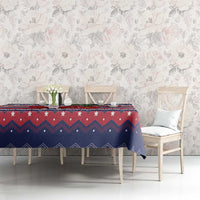 Christmas tablecloth on table with navy, red and white chevrons and stars, styled with chairs