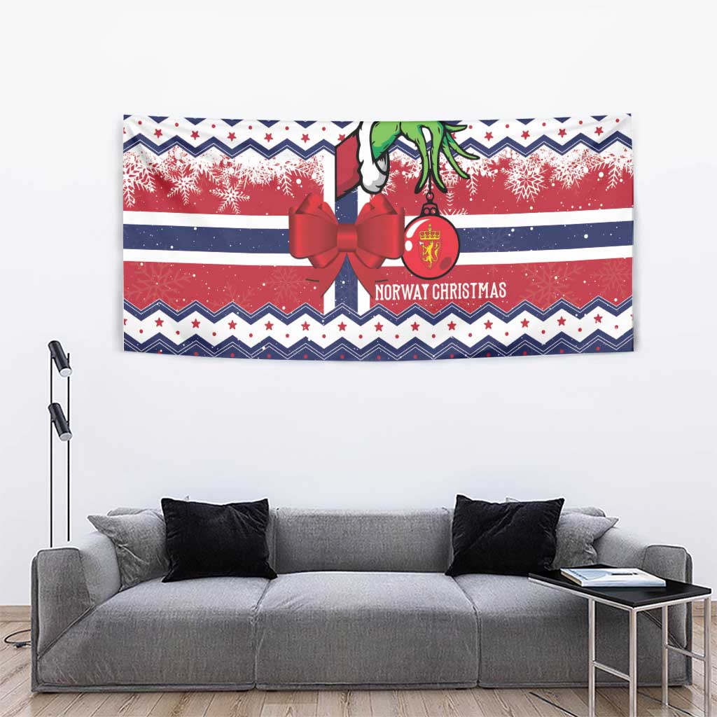 Blue Norway Christmas tapestry featuring a red ribbon bow, green figure, snowflake bands, and stripes