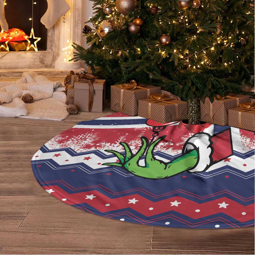 Round Christmas tree skirt with blue, red and white Norway-themed print and fringe edge