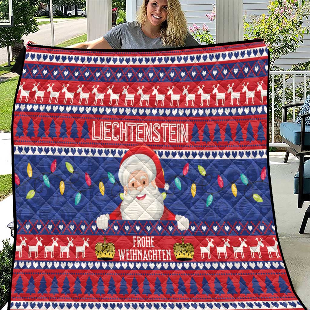 Red and blue Christmas quilt with Santa figure and white “Liechtenstein” lettering