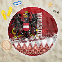 Red and white round Christmas beach blanket with eagle crest and fringe, 150cm.