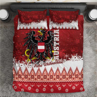 Red and white Christmas bedding set with eagle crest, snowflake bands, and knit-pattern trim.