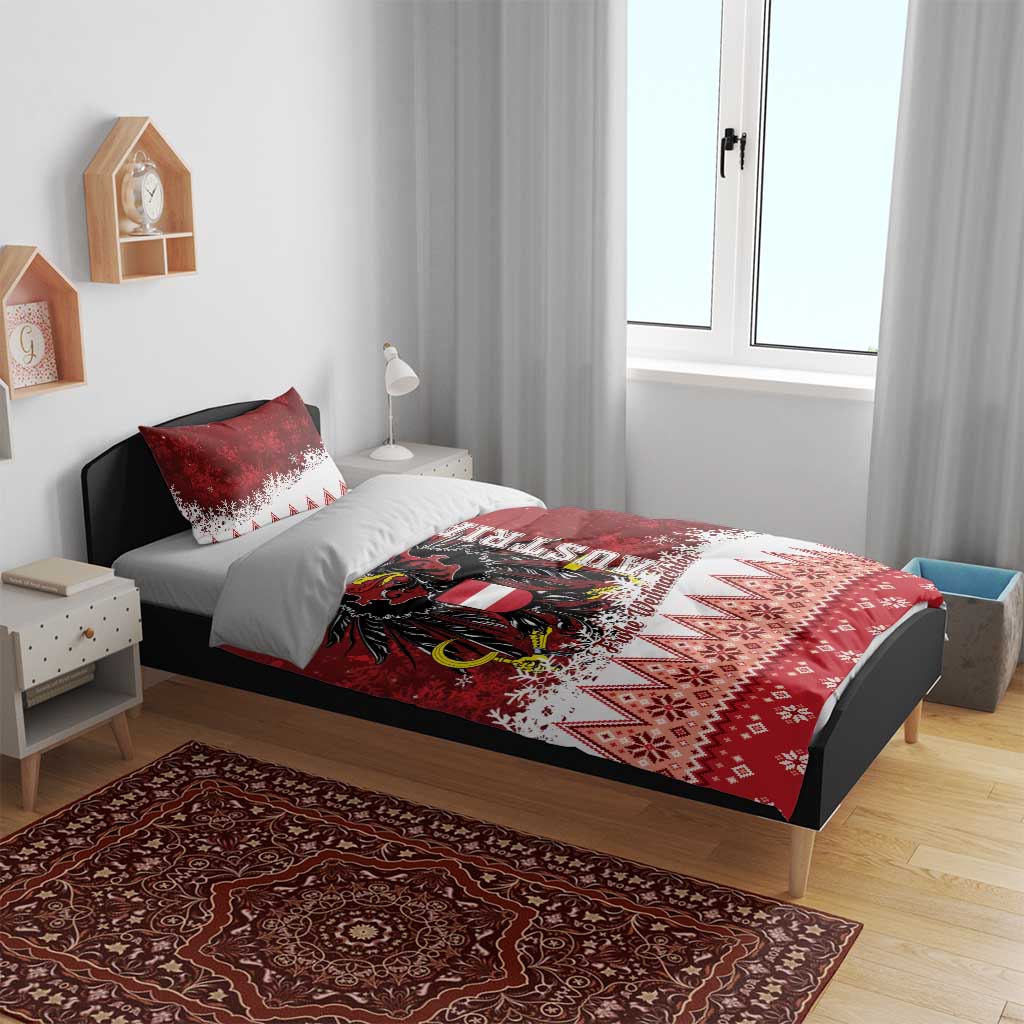 Red and white Christmas bedding set on bed with eagle crest, “Frohe Weihnachten,” and diamond border.
