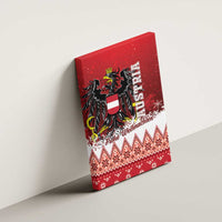 Red canvas wall art on wall with Austrian eagle crest and 'Frohe Weihnachten' text.