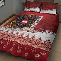 Red quilt bed set with black eagle artwork, white snowflake accents, two pillowcases