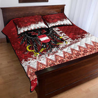 Red quilt bed set with black eagle centerpiece, white holiday motifs, two pillowcases
