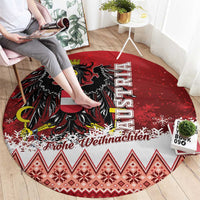 Red round Christmas eagle rug with black eagle graphic, shield, border pattern, 'Frohe Weihnachten'