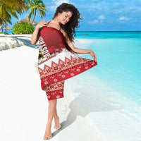 Red Christmas eagle sarong wrap with geometric trim and snowflake print