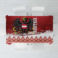 Red Christmas tablecloth with black eagle, snowflakes, and 'Frohe Weihnachten' text