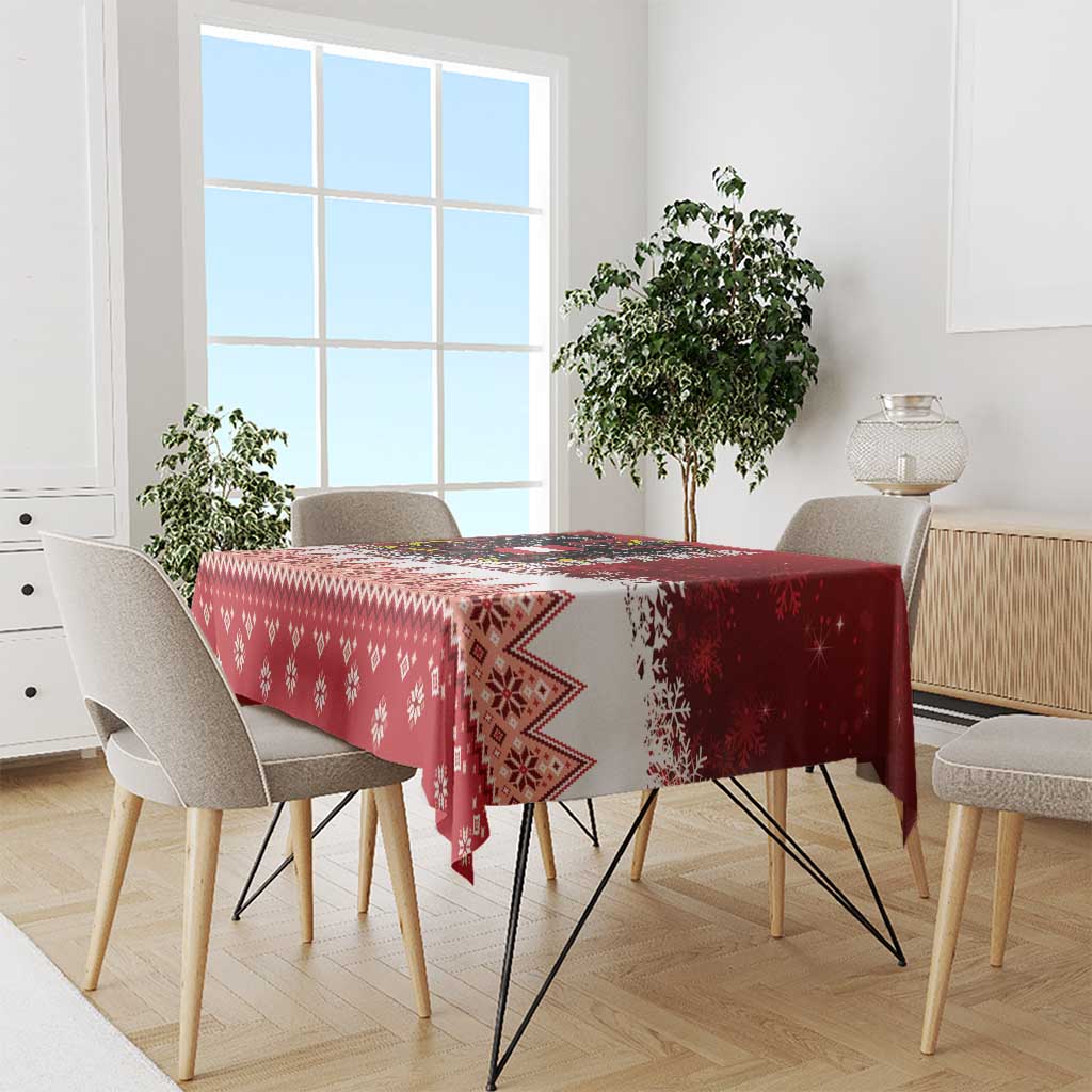 Red Christmas tablecloth with zigzag border and snowflake and diamond motifs