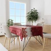 Red Christmas tablecloth with zigzag border and snowflake and diamond motifs