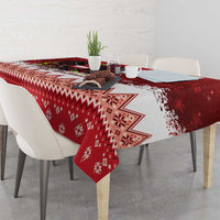 Red Christmas tablecloth with snowflake and diamond zigzag pattern across the surface