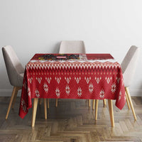 Red Christmas tablecloth with repeating snowflake and diamond pattern