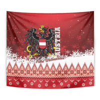 Close-up red Austria Christmas tapestry with eagle emblem, “Frohe Weihnachten,” and snowflake pattern