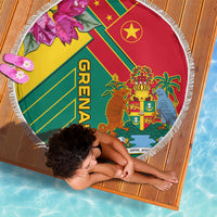 Round beach blanket with Grenada crest, bold stripes, and white fringe border.