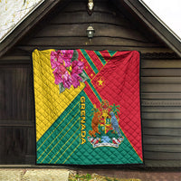 Grenada flag quilt blanket hanging on wall, quilted design with crest emblem and pink orchid